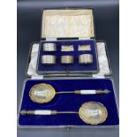 Boxed set of four Birmingham silver napkin rings. Together with a pair of Silver plate and mother of