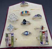 A Lot of 10 925 silver rings containing various gem and glass stones.