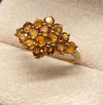 9ct yellow gold ring set with a cluster of citrine round cut stones. [Ring size R] [3.34grams]