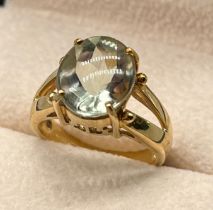 9ct yellow gold ring set with an oval cut aquamarine stone. [Ring size N] [5.66Grams]