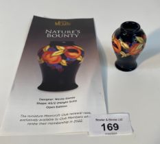 A Moorcroft 'Natures bounty' pattern small vase, designed by Nicola Slaney [5cm]