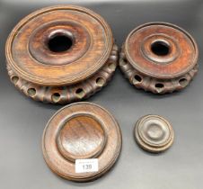 A Lot of four Chinese hand carved wooden bases/ stands. [largest- 25cm diameter]