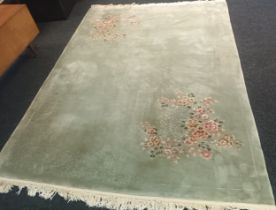 Chinese silk rug, pale green ground and floral sprays [380x280]