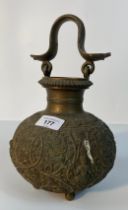 A 19th century Burmese vase with snake design handle set with Indian god scene supported on bun feet