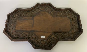 A 1900s heavily carved Serving tray in the style of black forest [75x50cm]