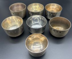 A Collection of seven silver hallmarked whisky drinking cups; Six London and one Edinburgh