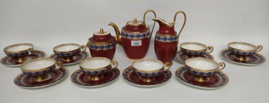 A Victorian french Serves red back ground tea service set in flower design; cups, plates & tea pot &