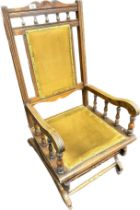 19th century rocking chair, the back and seat covered in a mustard upholstery [106cm]