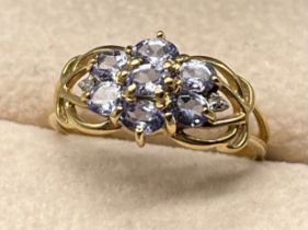 9ct yellow gold ring set with various pale purple gem stones [Ring size Q] [2.19Grams]