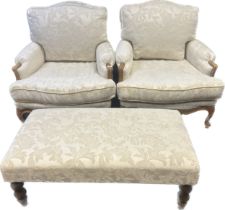 Antique French style armchairs, the whole covered in a neutral upholstery, with footstool