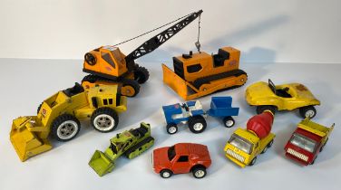 A collection of vintage Tonka vehicles; Tonka Rotating Crane, Tonka T-6 Bulldozer & other vehicles