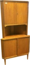 Mid Century unit, the top with cupboard doors opening to shelves interior above an open display area