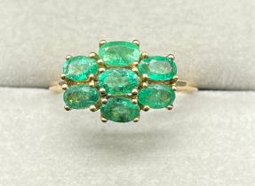 10ct yellow gold ring set with seven oval cut emerald gem stones. (Ring size Q) (2.27grams)