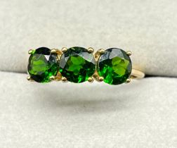 9ct yellow gold ring set with three round cut green tourmaline gem stones. (Ring size Q) (2.36grams)