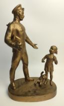 A Vintage Soviet ''WWll soldier and girl with bear'' cast iron statue, dated 1977.