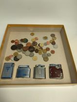 A collection of old coins & collectable lighters