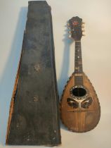 An antique mandolin by makers F.de Mureda Napoli with case