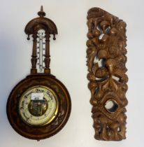 A Carved wooden tribal panel along with German aneroid barometer