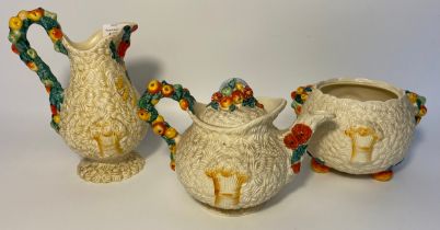 A collection of Clarice Cliffe Celtic Harvest; Tea pot, sugar and cream
