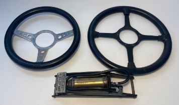 2 Moto-Lita steering wheels together with a Dunlop Champion foot pump