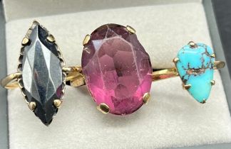 Three various 9ct yellow gold rings; 9ct and large oval purple stone ring- ring size M, 9ct and