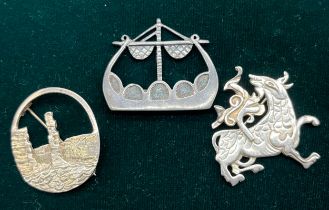 Three Silver Ola Gorie brooches; Viking long boat brooch, Maeshowe Dragon brooch and one other