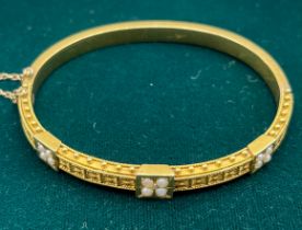 Victorian/ Antique 18ct yellow gold bangle fitted with seed pearls. [11.85grams]