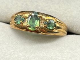 9ct yellow gold ring set with three oval cut green topaz gem stones. [Ring size N] [2.72Grams]