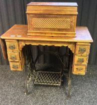 Antique Singer sewing machine table, together with some sewing contents