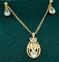 9ct yellow gold Mackintosh style pendant with blue oval stone fitted together with a matching pair