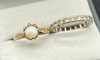 Two 9ct gold rings; 9ct yellow gold ring fitted with a single pearl- ring size J. 9ct white gold