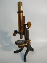 Antique table top microscope fitted with brass attachments.