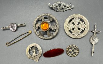 A Collection of silver brooches; Two Victorian circular silver Celtic design brooches, Edinburgh