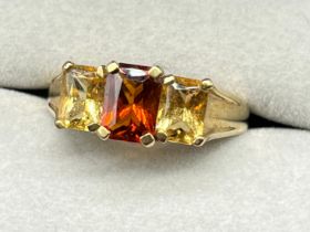 9ct yellow gold ring set with three emerald cut citrine gem stones- orange and two yellow citrine
