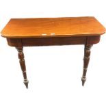 19th century table, the D shaped surface over an inlaid freeze and raised on turned legs [74.5x106.