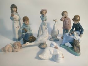 A Large collection of Nao figurines; A girl attending the rabbits figure & other figures