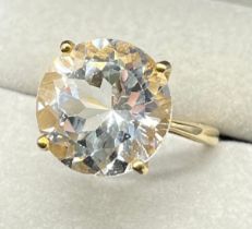 9ct yellow gold ring set with a large round cut white topaz gem stone. [Ring size M] [5.71Grams]