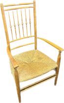 An Antique Arts and Crafts Spindle Back Chair with Rush Seat.