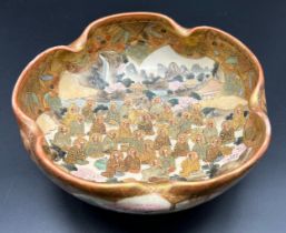 Antique Japanese Satsuma crimped edge bowl. Hand painted with various figures seated with village