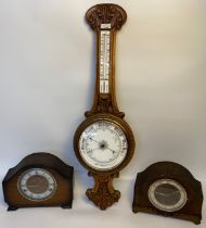 An Oak Aneroid barometer along with two mantle clocks [85cm]