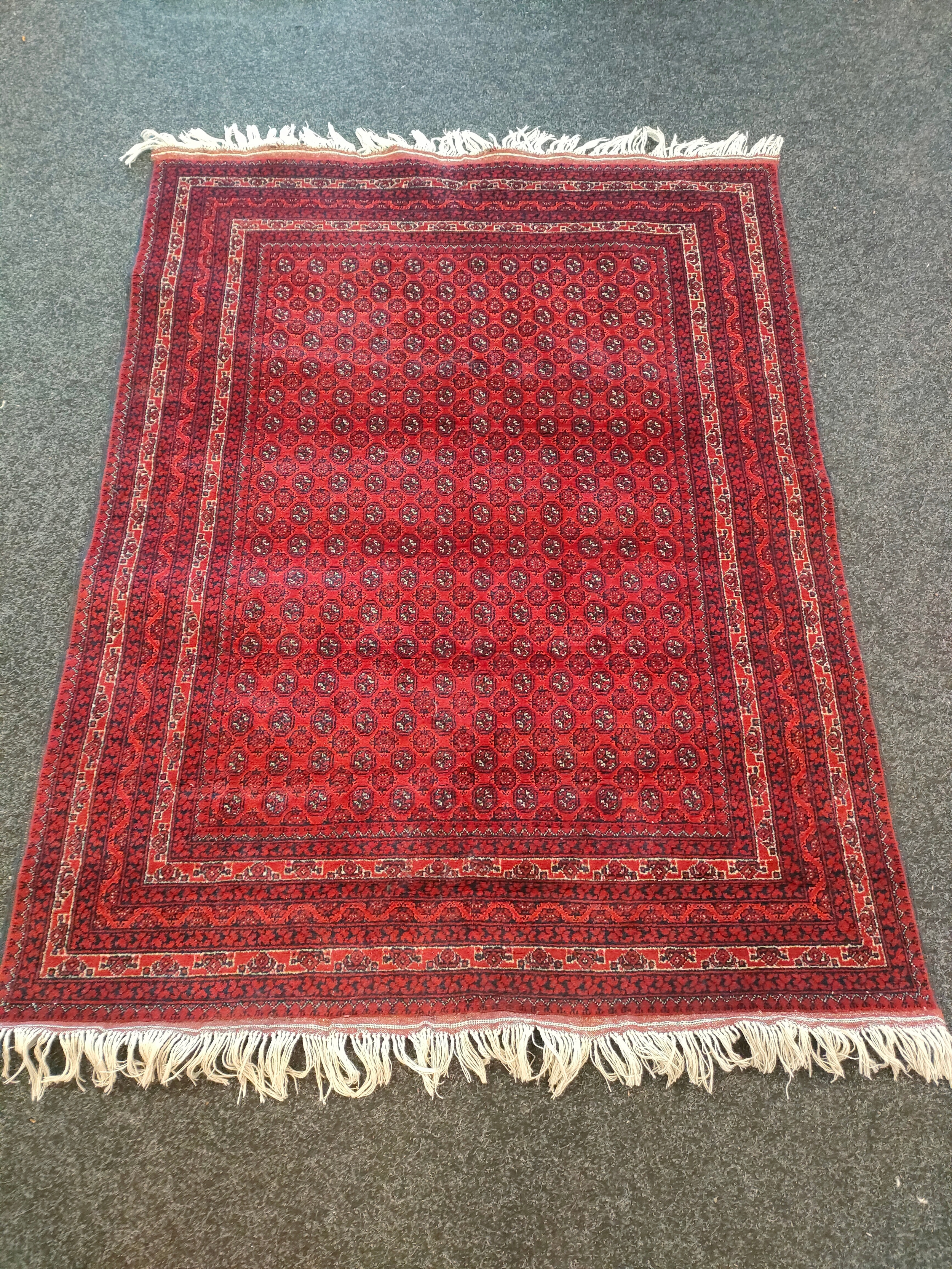 A Large Afghan hand woven red rug with shite trimming [201x154cm]