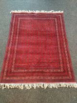 A Large Afghan hand woven red rug with shite trimming [201x154cm]