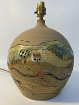 Scottish studio pottery table lamp depicting countryside scenes with thatched roofed houses by E.