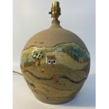 Scottish studio pottery table lamp depicting countryside scenes with thatched roofed houses by E.