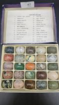 A Collection of Gemstone eggs in fitted display box