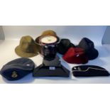 Vintage police hat & fez hat together with a Scottish military ice bucket