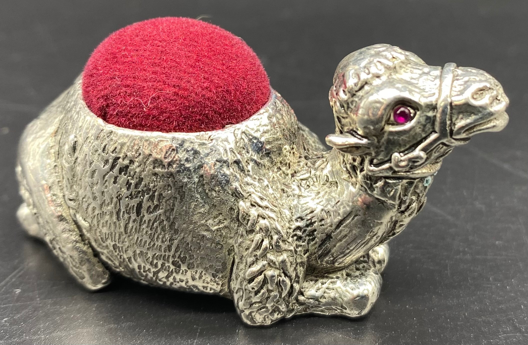 Heavy silver plated camel pin cushion set with Ruby eyes - Image 2 of 2