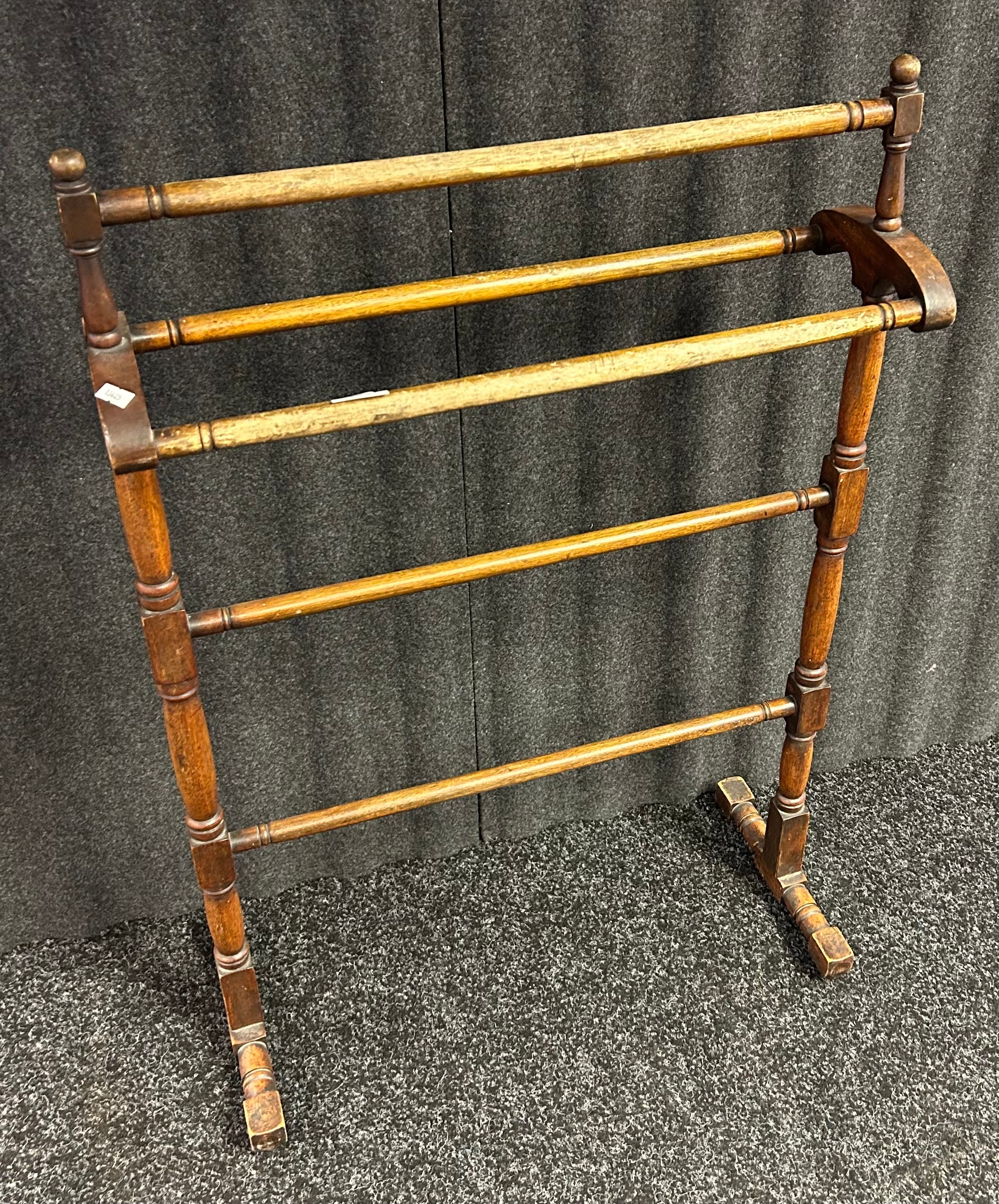 Antique towel rail, raised on pedestal legs