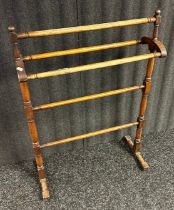 Antique towel rail, raised on pedestal legs