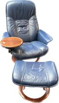 Erkorness stressless leather chair with attached tray and matching footsool.